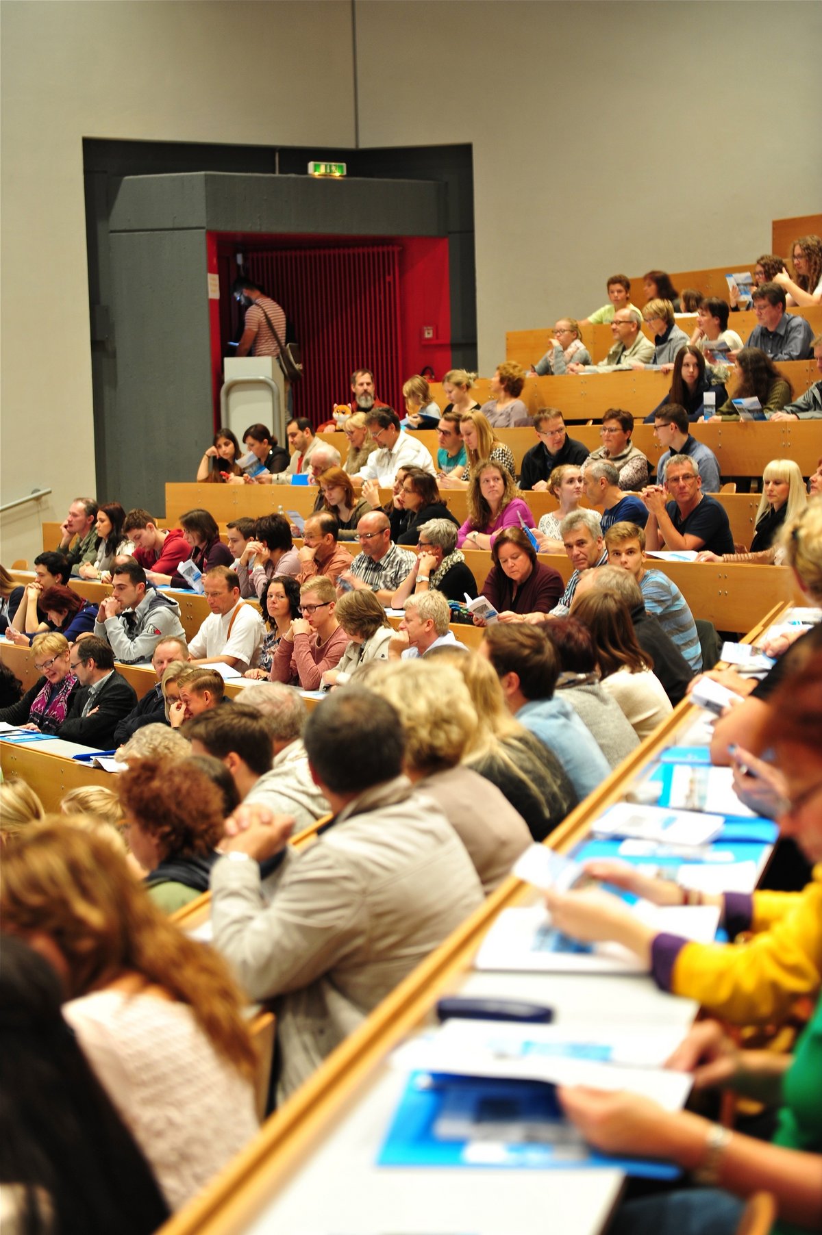Students take part in a larger lecture in the university auditorium